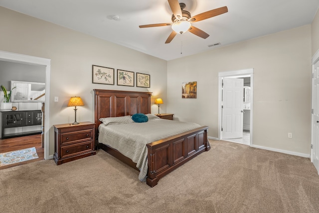 bedroom featuring ceiling fan and light carpet