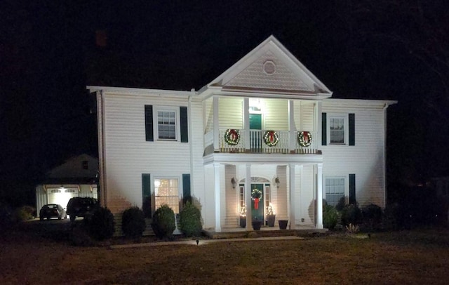 view of front of house featuring a balcony