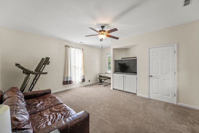 carpeted living room featuring ceiling fan