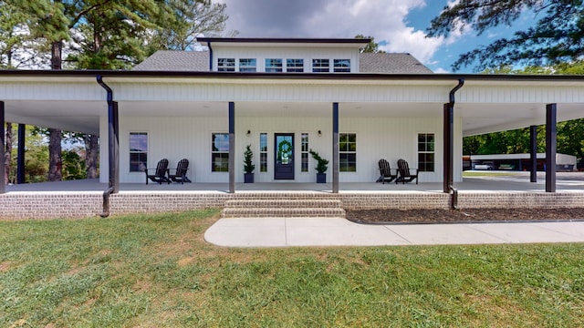 back of property featuring a patio and a yard