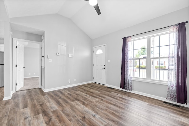 entrance foyer featuring vaulted ceiling, hardwood / wood-style floors, and ceiling fan