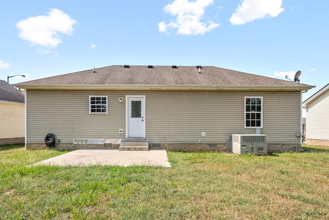 back of house with cooling unit, a lawn, and a patio