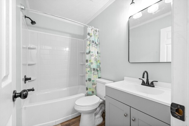 full bathroom featuring hardwood / wood-style floors, toilet, shower / tub combo, vanity, and ornamental molding