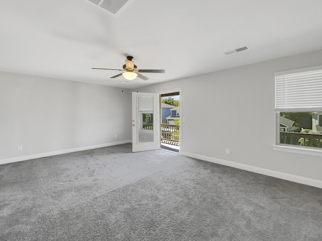 carpeted empty room featuring ceiling fan