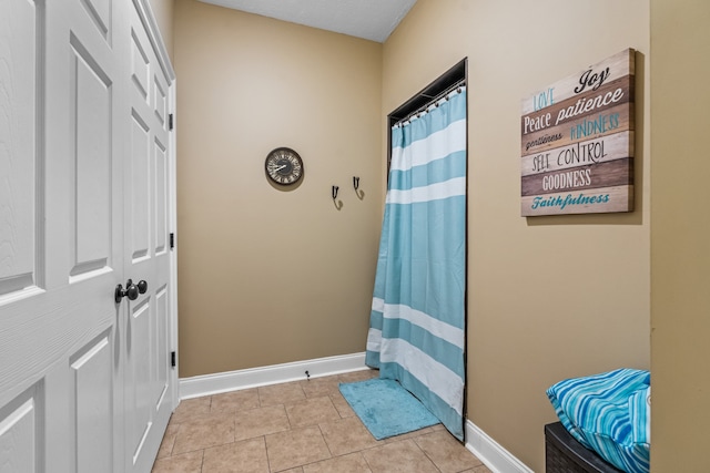 doorway to outside featuring light tile patterned floors