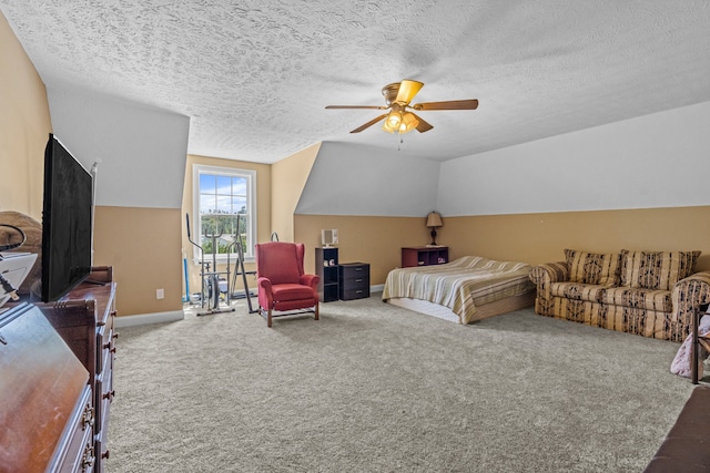 carpeted bedroom with a textured ceiling, ceiling fan, and vaulted ceiling