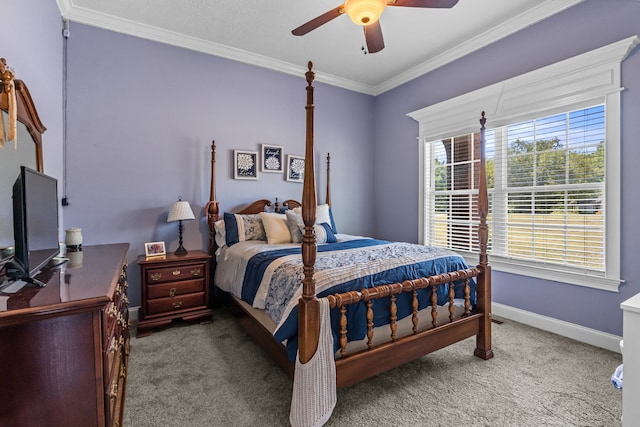 bedroom with ceiling fan, ornamental molding, and carpet floors