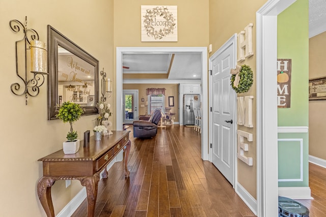 interior space with wood-type flooring and ornamental molding