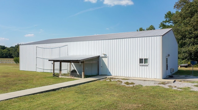 view of outbuilding with a yard