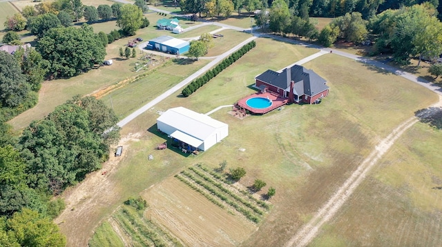 birds eye view of property with a rural view