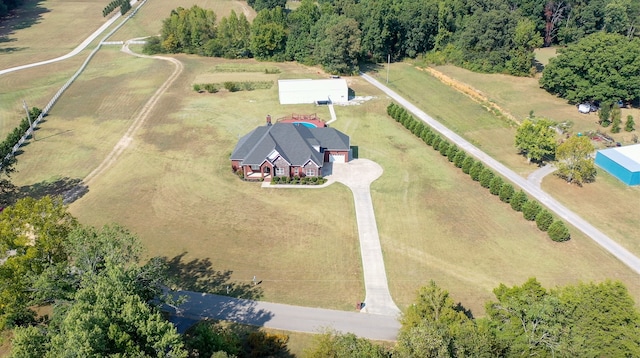 birds eye view of property with a rural view