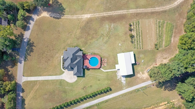 birds eye view of property with a rural view