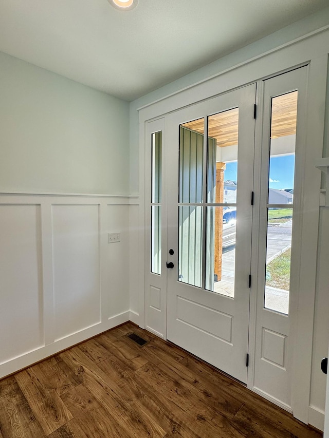 doorway with dark hardwood / wood-style flooring