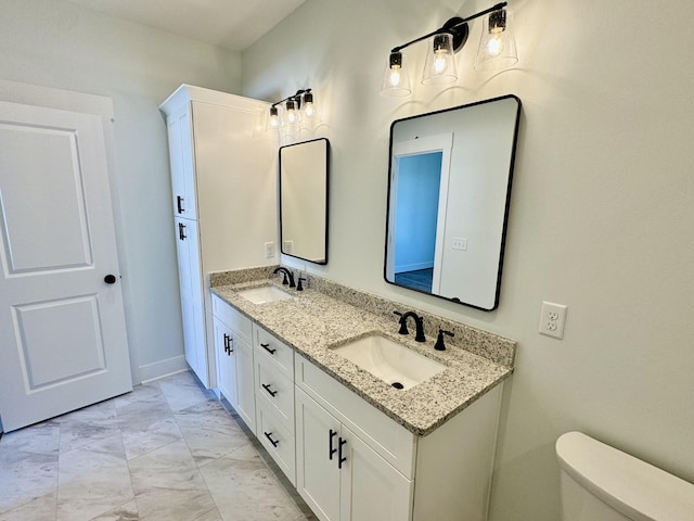 bathroom with vanity and toilet