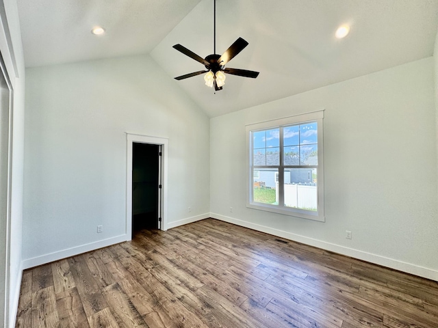 unfurnished bedroom with hardwood / wood-style floors, a walk in closet, a closet, and ceiling fan