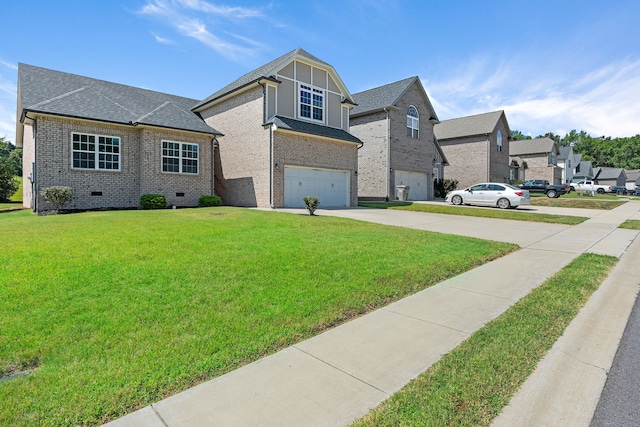 view of front of home with a garage and a front yard