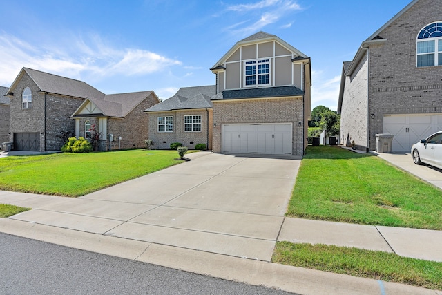 view of front of property featuring a garage and a front yard