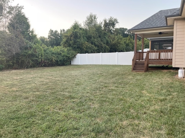 view of yard with a wooden deck