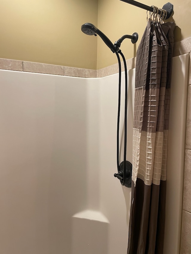 bathroom with a shower with curtain