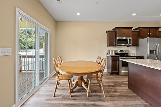 dining area with light hardwood / wood-style flooring