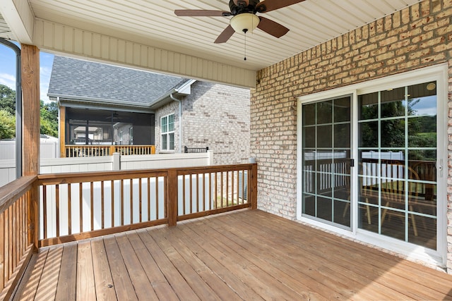 wooden terrace featuring ceiling fan