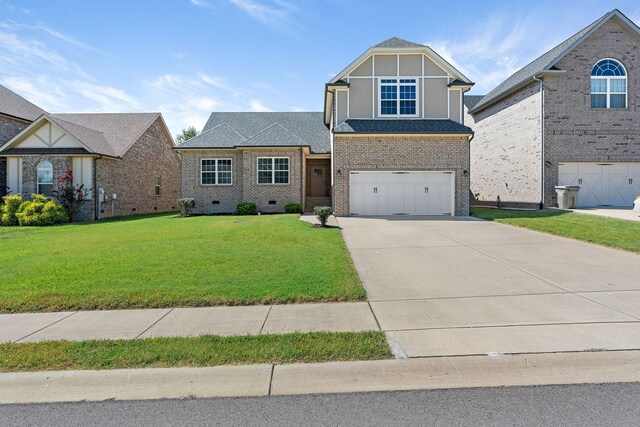 view of front facade with a garage and a front yard