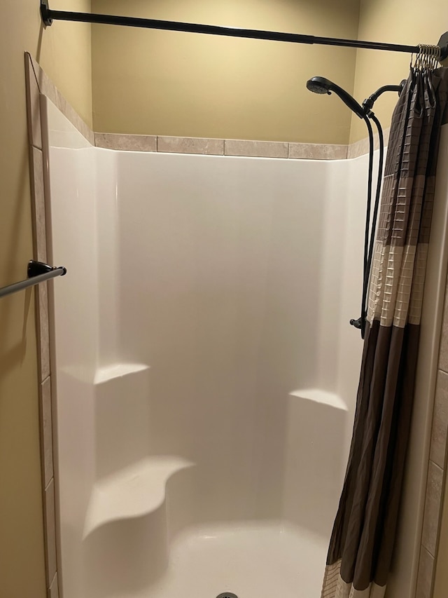 bathroom with a shower with curtain