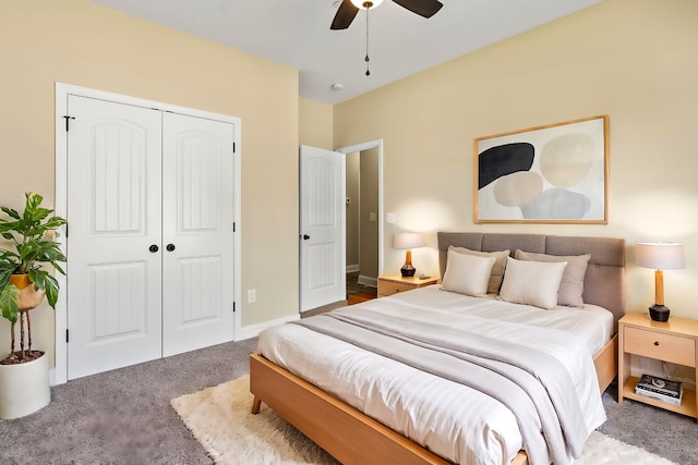 bedroom featuring dark carpet, a closet, and ceiling fan