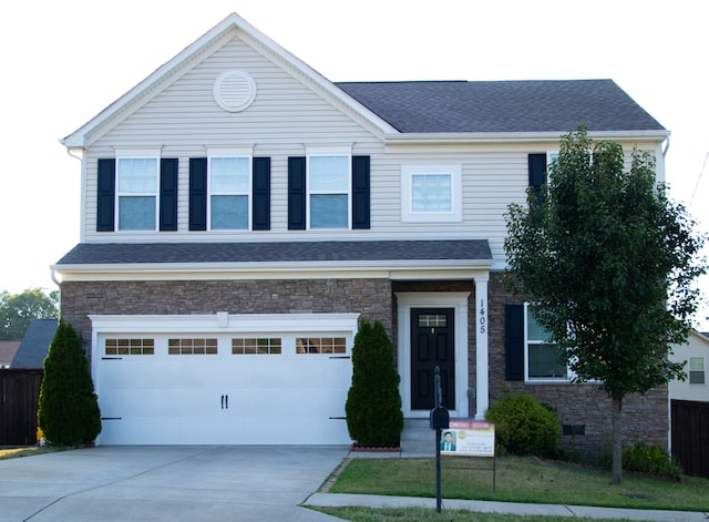 view of front of property with a garage