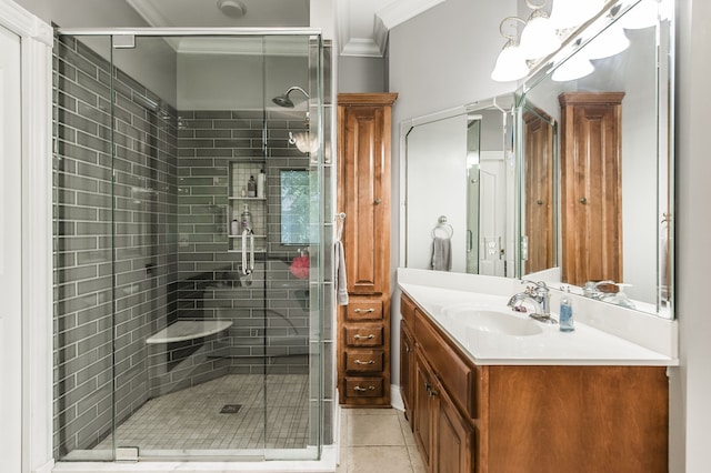 bathroom featuring a shower with door, vanity, tile patterned flooring, and crown molding