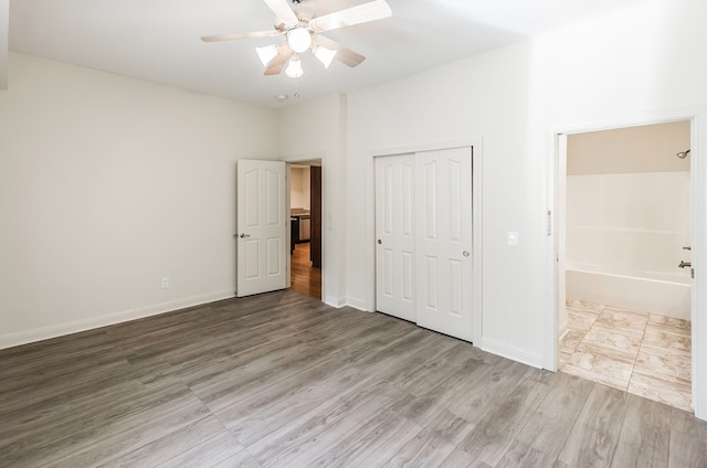 unfurnished bedroom featuring a closet, ceiling fan, and light hardwood / wood-style flooring