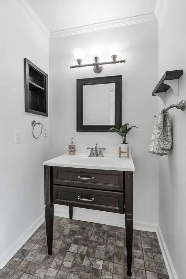 bathroom featuring vanity and ornamental molding