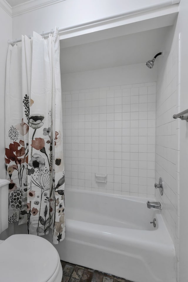 bathroom with crown molding, toilet, and shower / tub combo