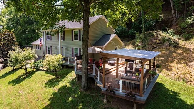 back of house with a yard and a deck