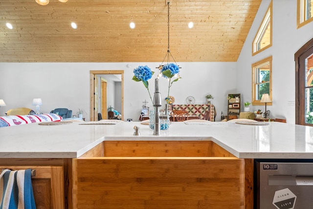 kitchen featuring hanging light fixtures, light countertops, and open floor plan