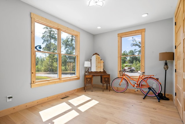 interior space with visible vents, plenty of natural light, and light wood-style flooring