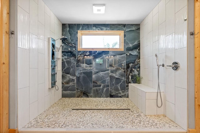 bathroom with a marble finish shower