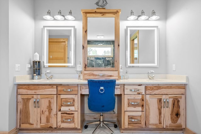 full bathroom with two vanities and a sink