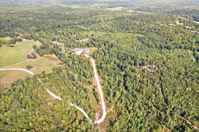 birds eye view of property with a wooded view