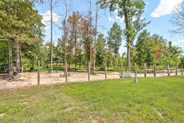 view of yard with fence and a gazebo