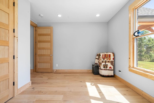 interior space with recessed lighting, light wood-style flooring, and baseboards