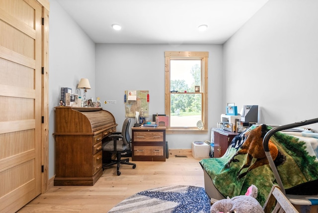 home office featuring light wood-style flooring