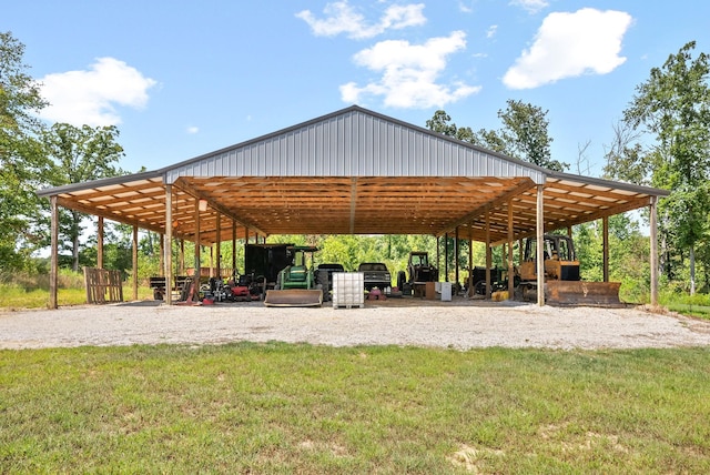 view of property's community featuring a carport, a lawn, and driveway