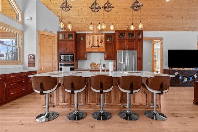 kitchen featuring stainless steel appliances, a spacious island, wood ceiling, hanging light fixtures, and glass insert cabinets