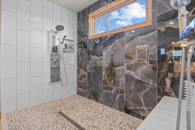 bathroom featuring a tile shower