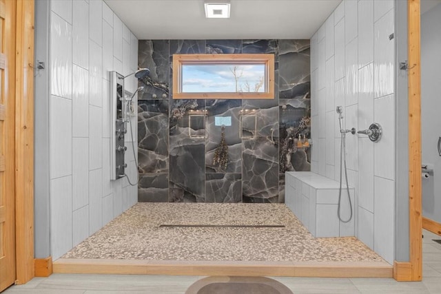 full bath featuring visible vents and a marble finish shower