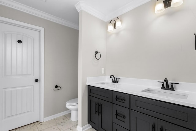 bathroom featuring ornamental molding, marble finish floor, a sink, and baseboards