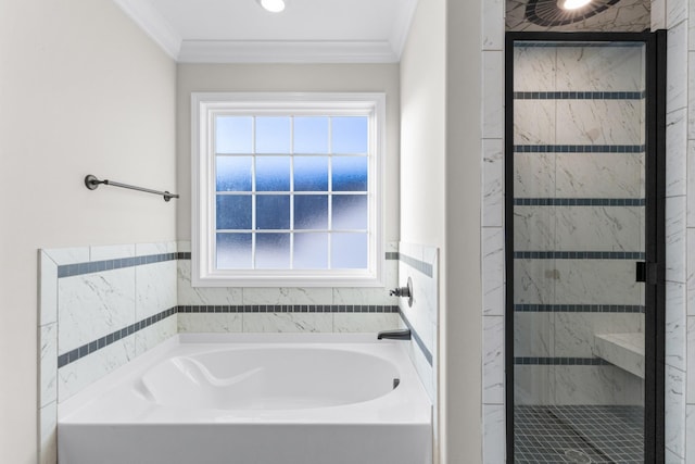 bathroom featuring ornamental molding, a stall shower, and a bath