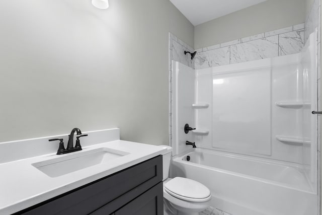 bathroom featuring shower / bathing tub combination, vanity, and toilet