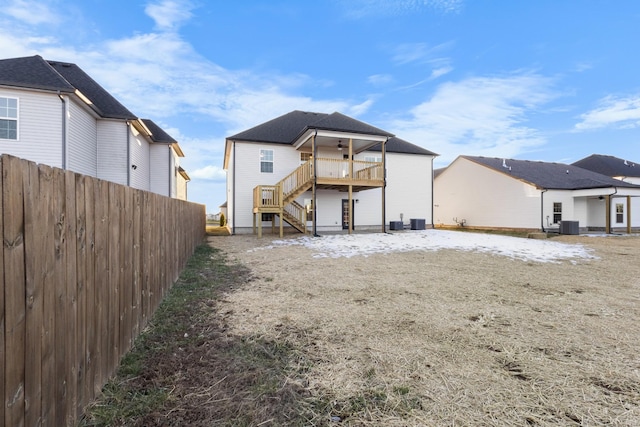 back of house with central AC unit, stairway, fence, and a ceiling fan